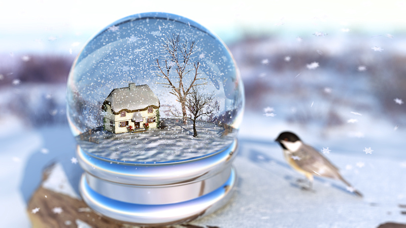 Inside a snow globe is a winter landscape with a cottage overshadowed by bare maple and cherry trees. Snow glitters on the lawn, holly bushes covered with bright red berries flank the door, and snowflakes tumble through the frozen air. Beside the globe a little chickadee looks curiously in at the miniature scene.